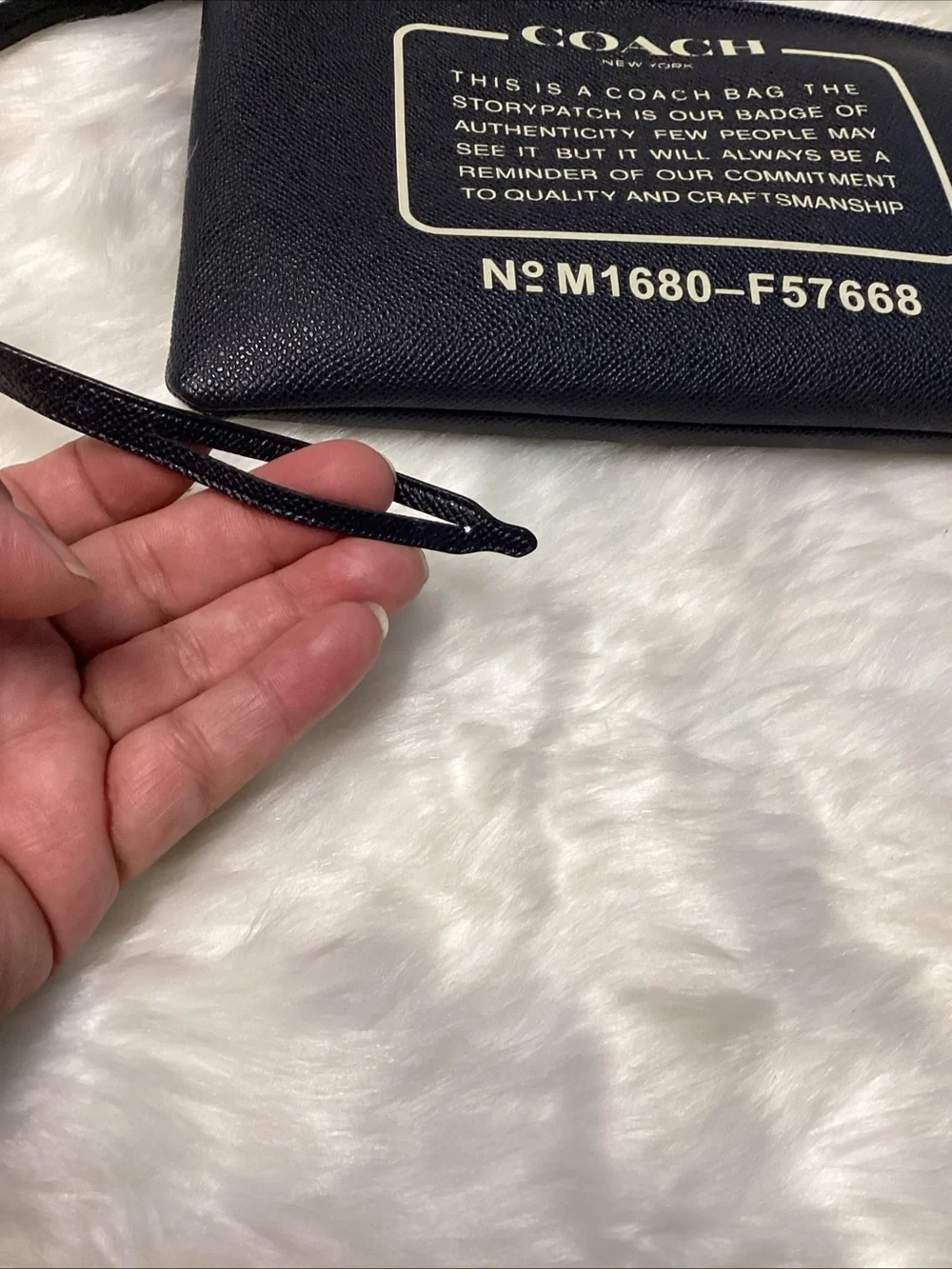Coach Navy Wristlet with Cream Logo Text